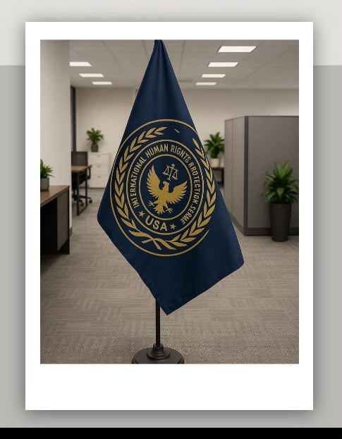 Navy and gold International Human Rights Protection Service, USA flag displayed in an office